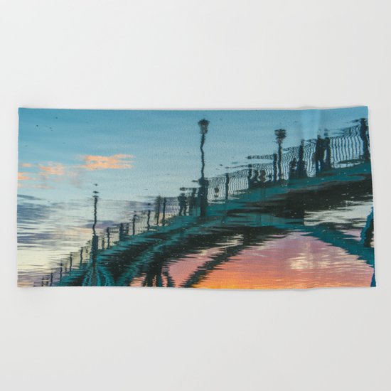 the reflection of the pedestrian bridge Beach Towel