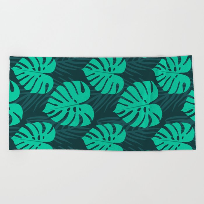 Monstera and Palm Leaves on Deep Blue Beach Towel