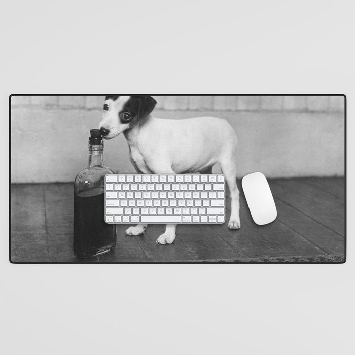His Master’s Vice; Dog with bottle of master's whiskey black and white photograph - photography - photographs Desk Mat