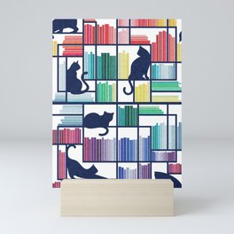 Rainbow bookshelf // white background navy blue shelf and library cats Mini Art Print