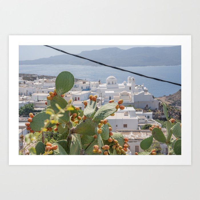 Milos landscape through cactuses / Rooftops of white Cycladic cubic houses / Blooming orange Barbary fig cactus Art Print