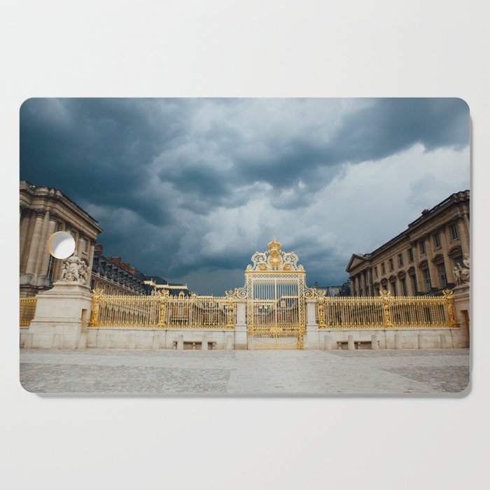 Dark Storm Clouds over the Golden Gates of Versailles in France  Cutting Board