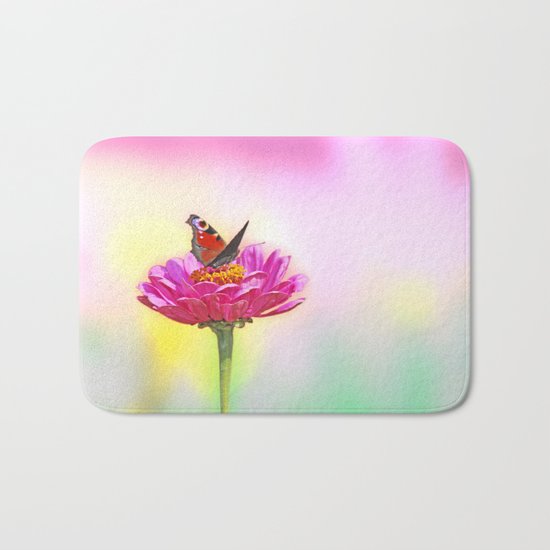Butterfly landing on pink flower Bath Mat