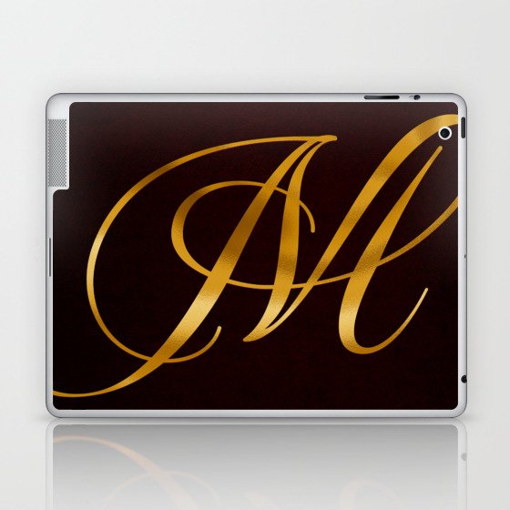 Golden letter M in vintage design Laptop & iPad Skin