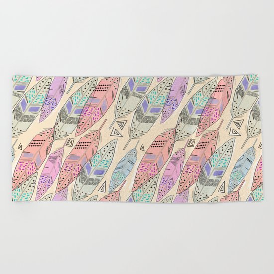 The feathers are multicolored on a beige background . Beach Towel