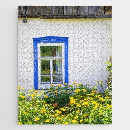 Old rustic house with high yellow flowers in the garden Jigsaw Puzzle