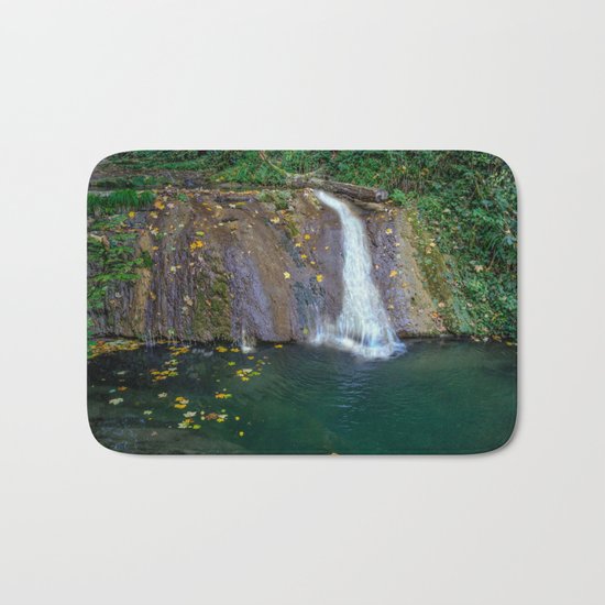 Autumn leaves in the waterfall Bath Mat