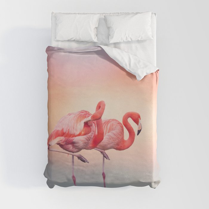 Two Pink flamingos in the water at sunset Duvet Cover