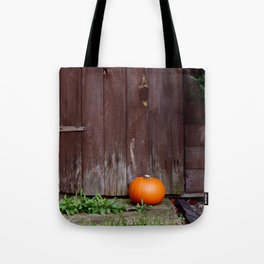 Orange pumpkin by wooden door Tote Bag