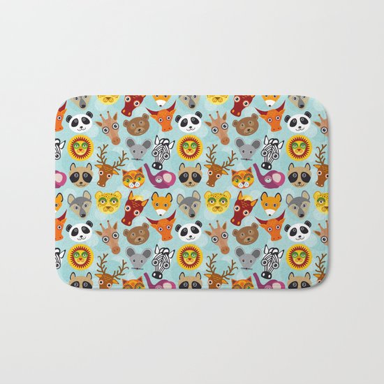 pattern with funny cute animal face on a blue background Bath Mat