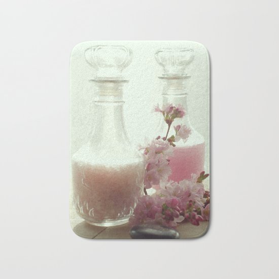 Bath salts and bath foam in still life Bath Mat
