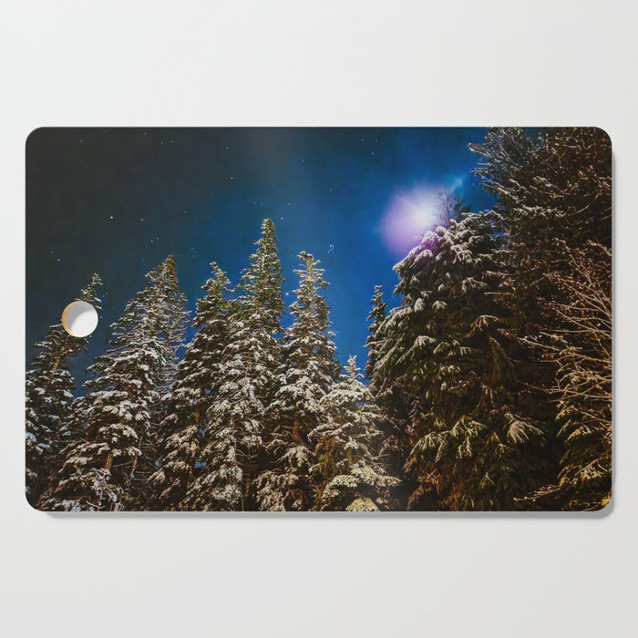 Moonlight on snowy trees Cutting Board