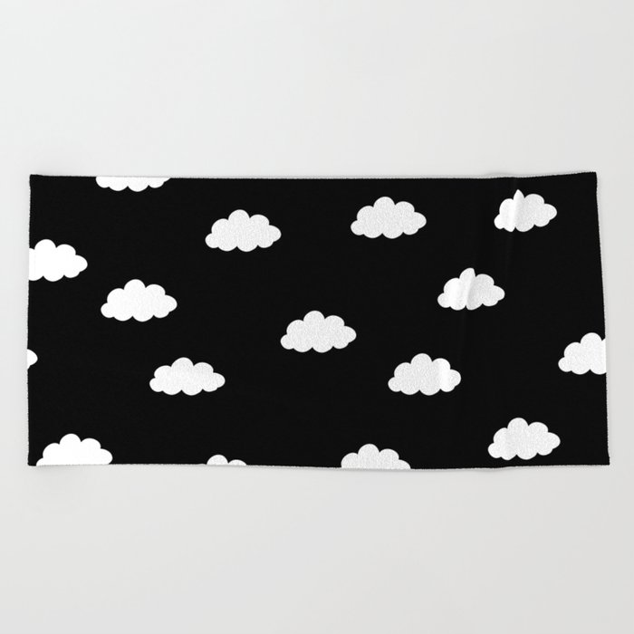 White clouds in black background Beach Towel