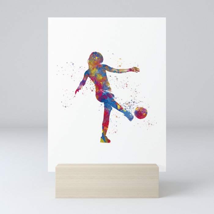 Soccer player kicking in watercolor Mini Art Print