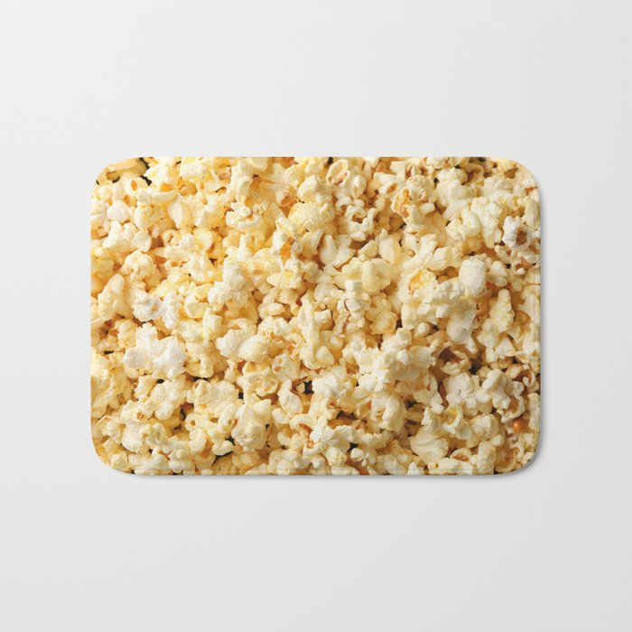 Tasty popcorn on whole background. Food for watching cinema Bath Mat
