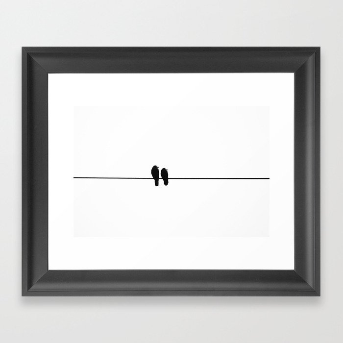 Birds on wire Framed Art Print