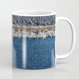 Straight stitch with orange thread on bleached denim fabric with fringe edge, on  blue denim background, text place, copy space. Denim blue jeans fabric frame. Worn Jeans Casual Double Color patch Coffee Mug
