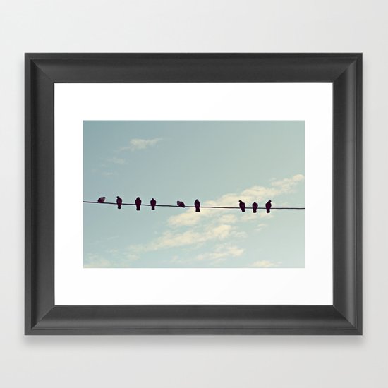 Birds on wire Framed Art Print