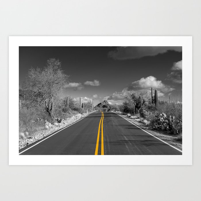 Art print of road across a black and white desert with the yellow lines leading the eye to the distance