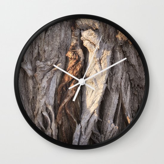 Abstract Human Figures In Gnarled Wood And White Cinder Block Wall