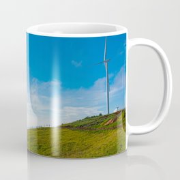 Wind turbines on the beautiful blue sky and on the tea field Coffee Mug