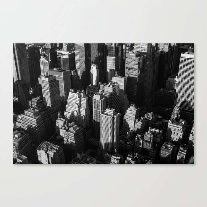 Tall buildings and skyscrapers with shadows of each other in the evening Canvas Print