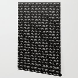 Zebra-print monkeys on black background Wallpaper