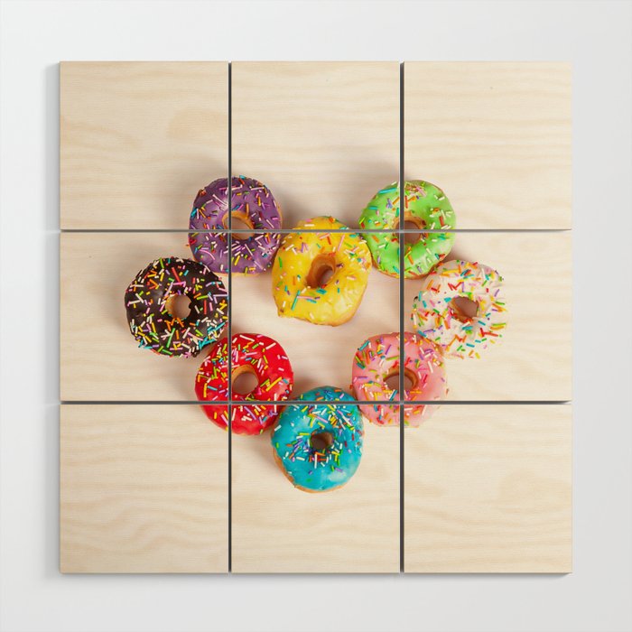 heart shaped colorful doughnuts on white studio background Wood Wall Art