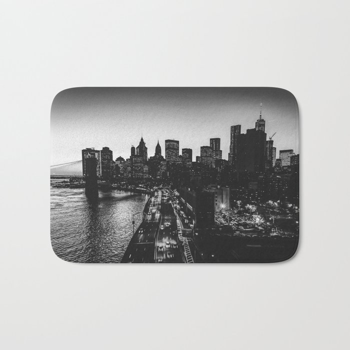 Brooklyn Bridge and Manhattan skyline at night in New York City black and white Bath Mat