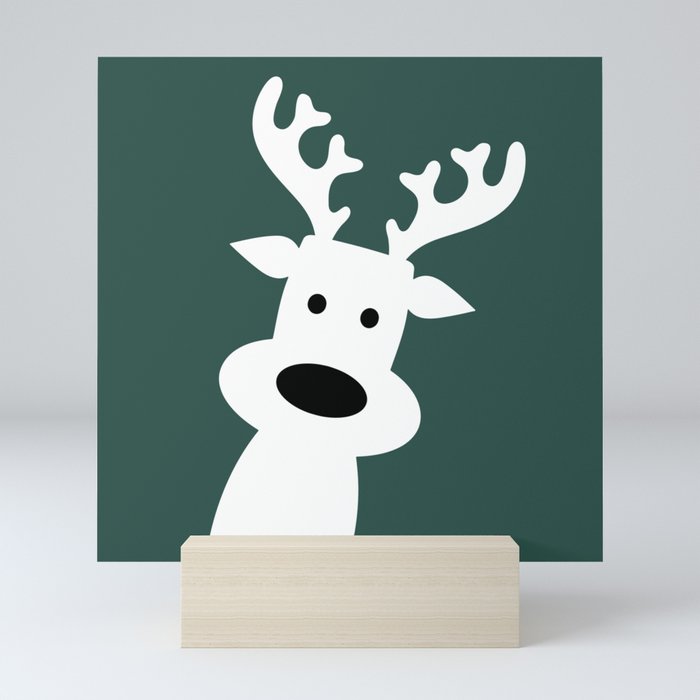 Reindeer on green background Mini Art Print