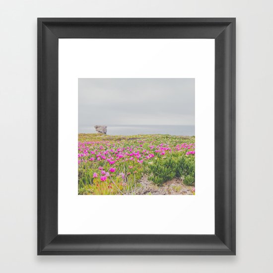 Across the flowers to the ocean Framed Art Print