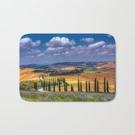 Cypress trees and meadow with typical tuscan house Bath Mat