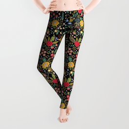 Amazing floral pattern with bright colorful flowers, plants, branches and berries on a black backgro Leggings