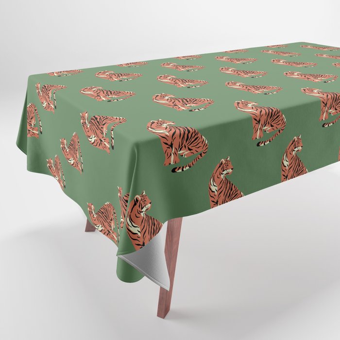 sitting tiger on green Tablecloth