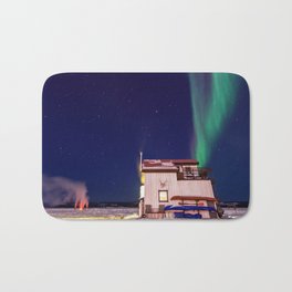 Northern Lights and house boat in Yellowknife Bath Mat