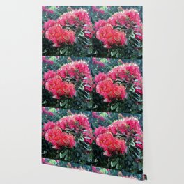 Red flower blossoms amid lush green foliage Wallpaper