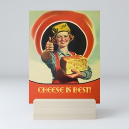 Young retro woman holding huge piece of Emmental cheese and smiling a nostalgic and vintage Mini Art Print