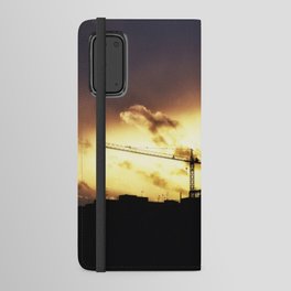 The sun set on construction crane Android Wallet Case