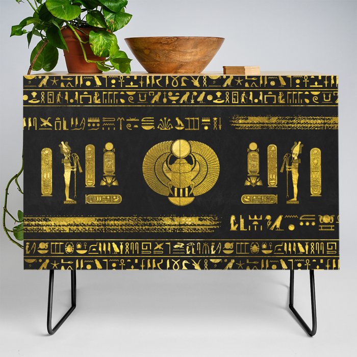 Golden Egyptian Scarab Ornament  on black leather Credenza