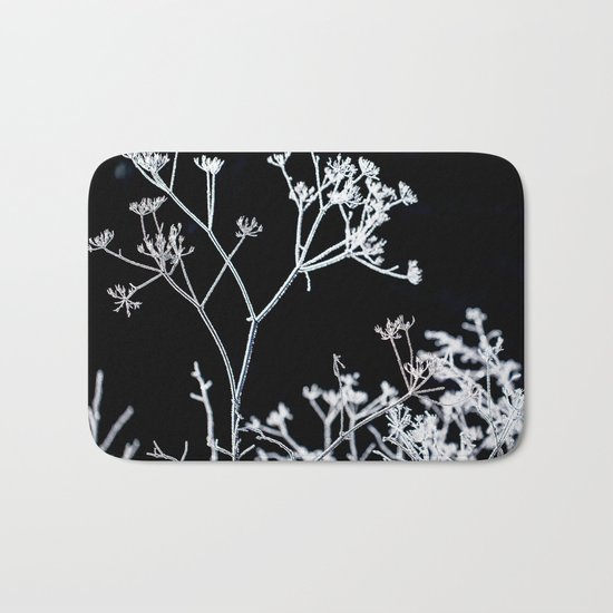 Frosted plant at cold winter day on black background Bath Mat