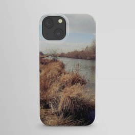Vintage riverside landscape at the end of winter iPhone Case