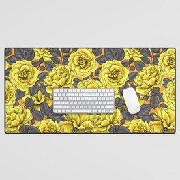 Yellow roses with dark gray leaves on orange Desk Mat