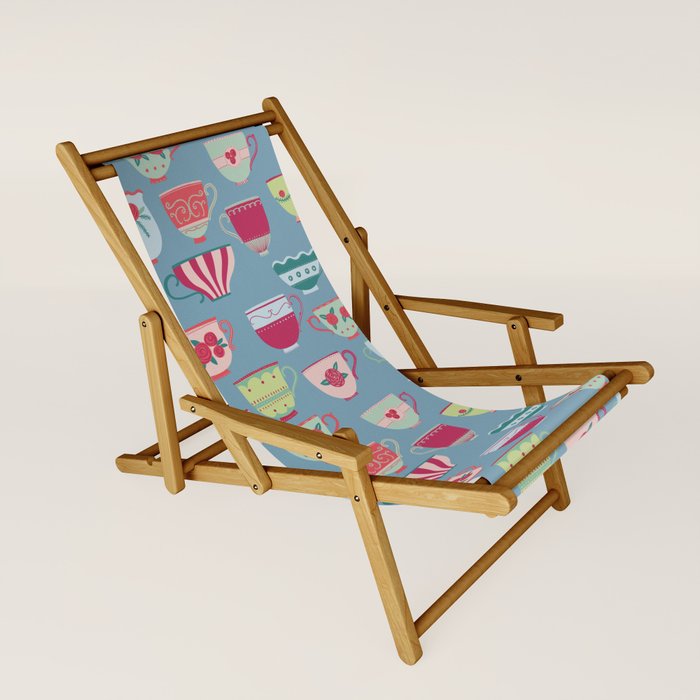 China Teacups On Teal Sling Chair By Squirrell
