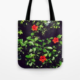 French riviera tropical garden | Red hibiscus flowers among green leaves | Spring botanicals Tote Bag