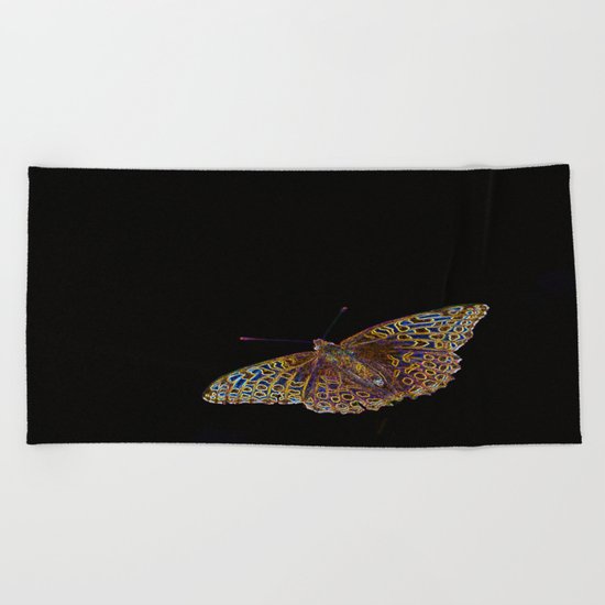 Butterfly on a black background Beach Towel