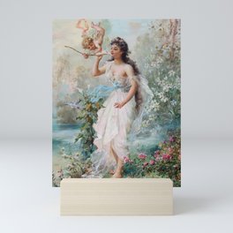 Hans Zatzka - Allegorical painting of two cherubs and a maiden in a classical landscape. Mini Art Print