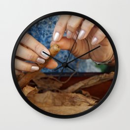 A cigar is lovingly finished.  Wall Clock