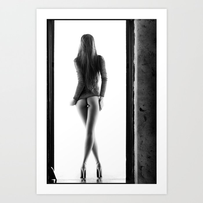 Woman standing in doorway Art Print