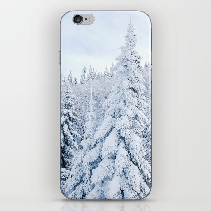 Snow covered forest iPhone Skin