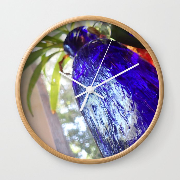 Blue glass and plant Wall Clock